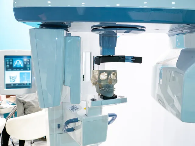 A hospital room with medical equipment and a monitor.